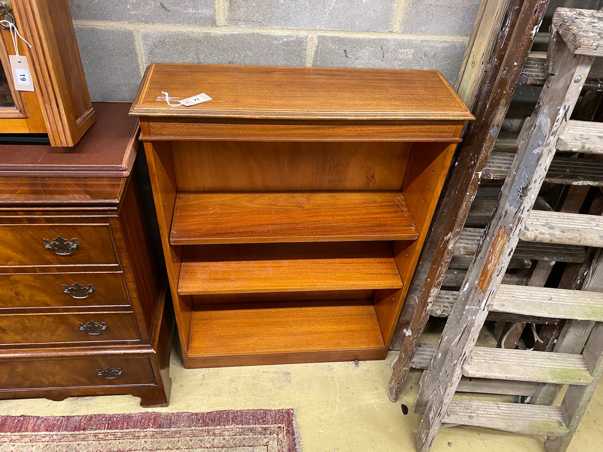 A reproduction Edwardian style mahogany open bookcase, width 79cm, depth 26cm, height 107cm
